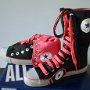 Knee High Chucks  Black and neon pink knee highs, with wide black and neon pink laces.